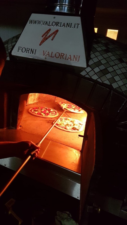Loading pizzas with the peel